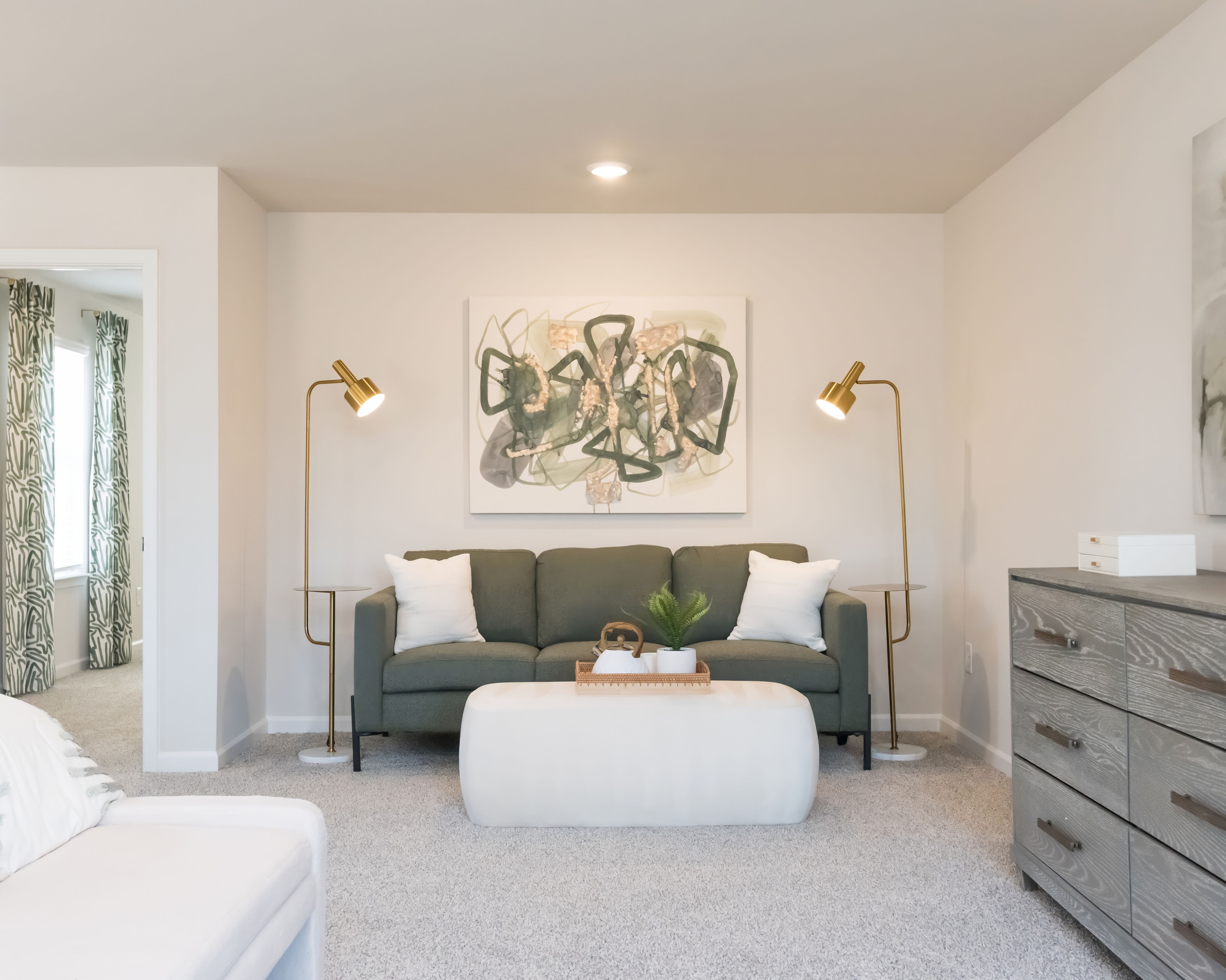 Discover a spacious sitting area in the primary bedroom.