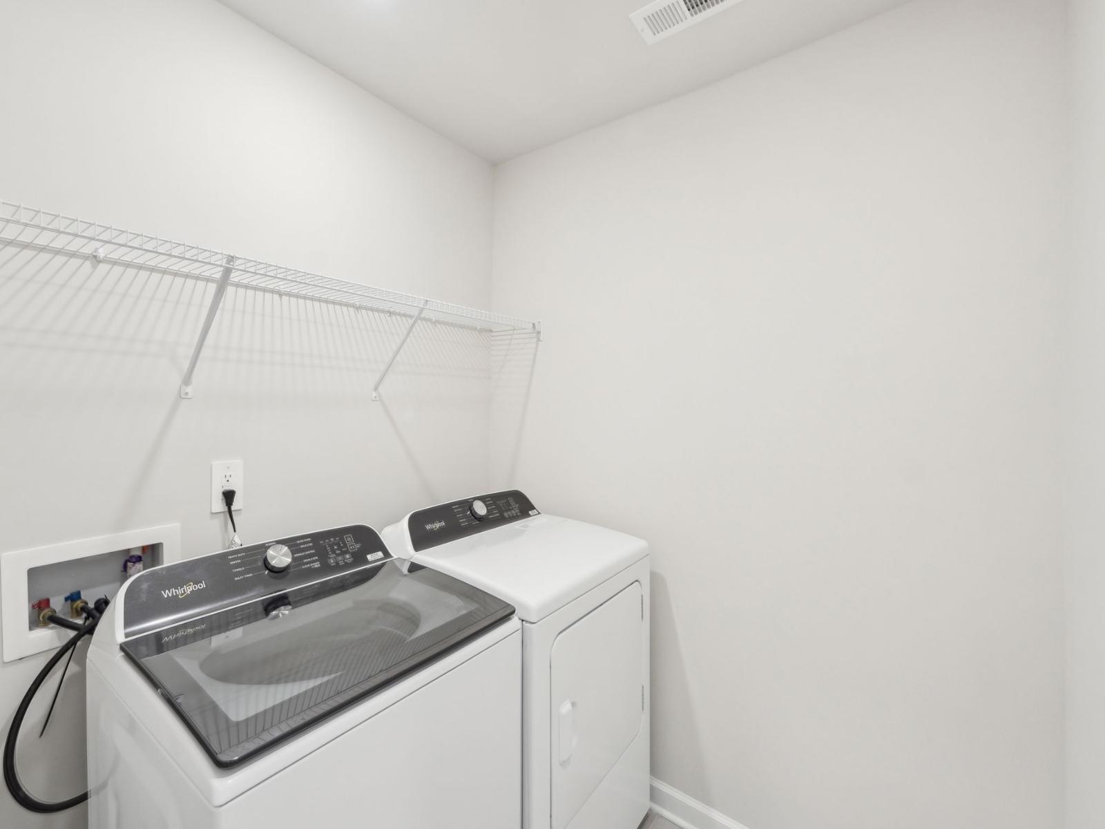 Enjoy laundry day with a large space and shelving to fold and organize clothes.