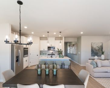 Prep dinner in the kitchen without missing a conversation in the dining area.