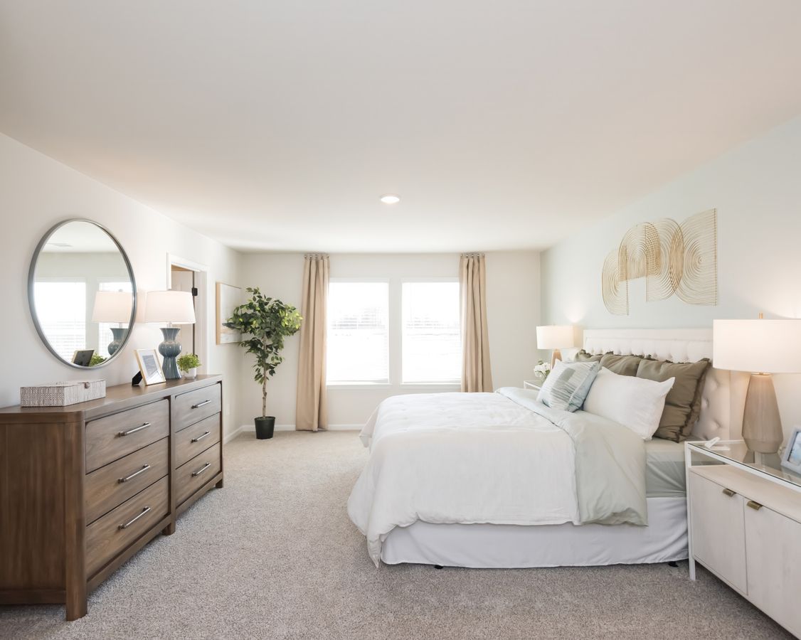 The primary suite is a private retreat to relax and unwind.