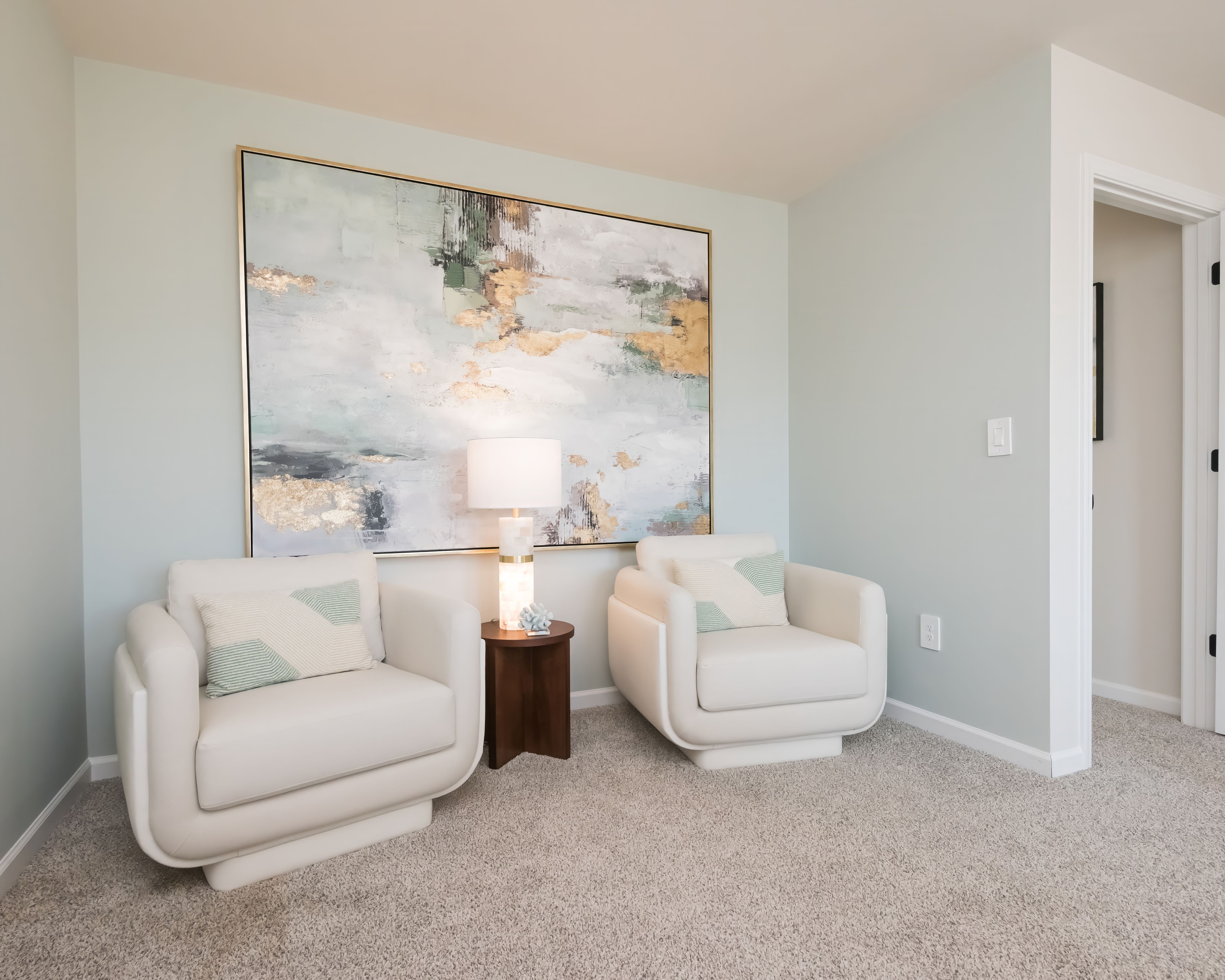 Get cozy and ready a book in the primary bedroom's sitting area.