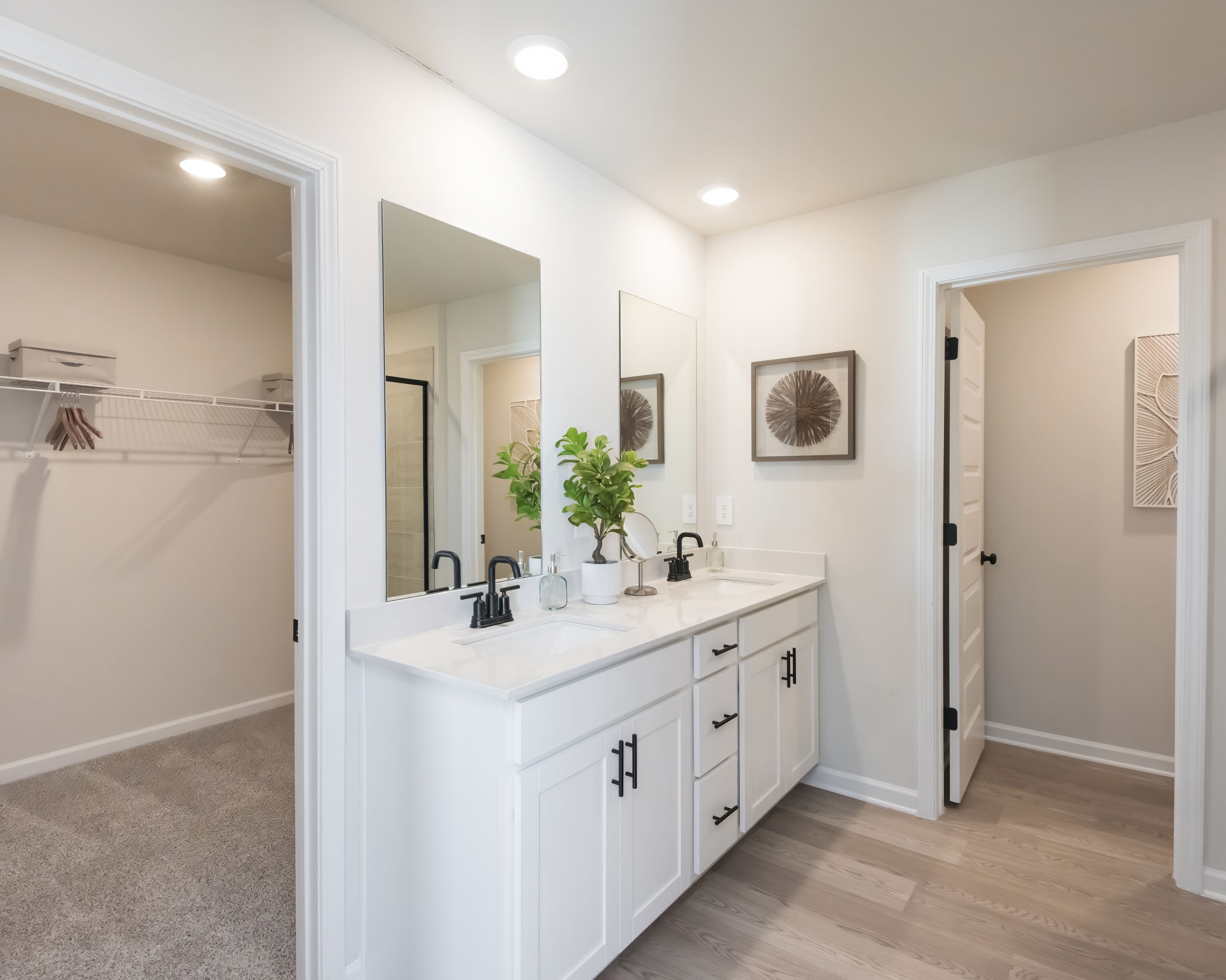 Dual-vanity sinks in the primary bathroom make getting ready in the morning a breeze.
