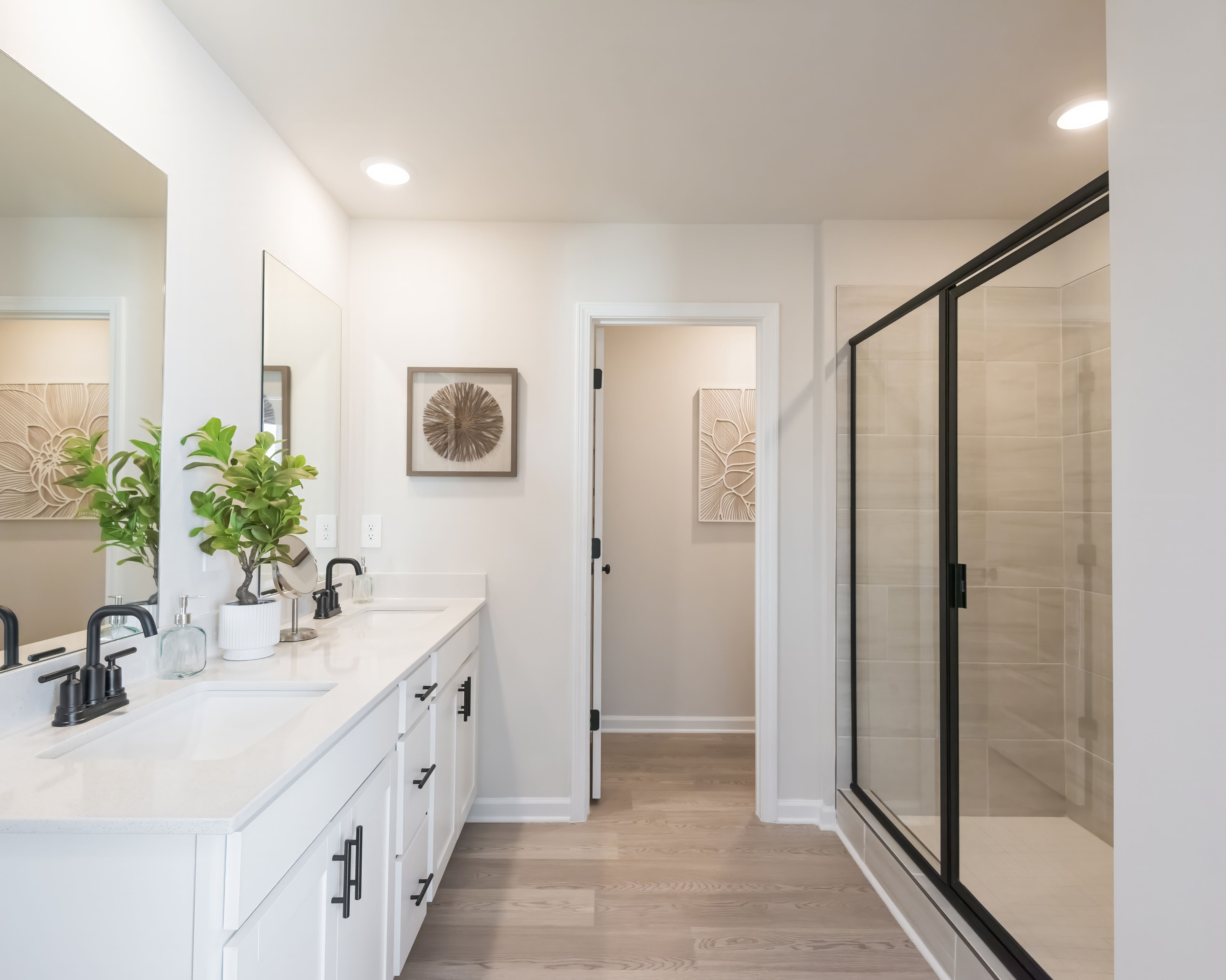 The primary bathroom features a luxurious walk-in shower.
