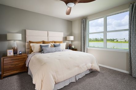Primary bedroom in the Canary floorplan modeled at Crescent Lakes at Babcock Ranch