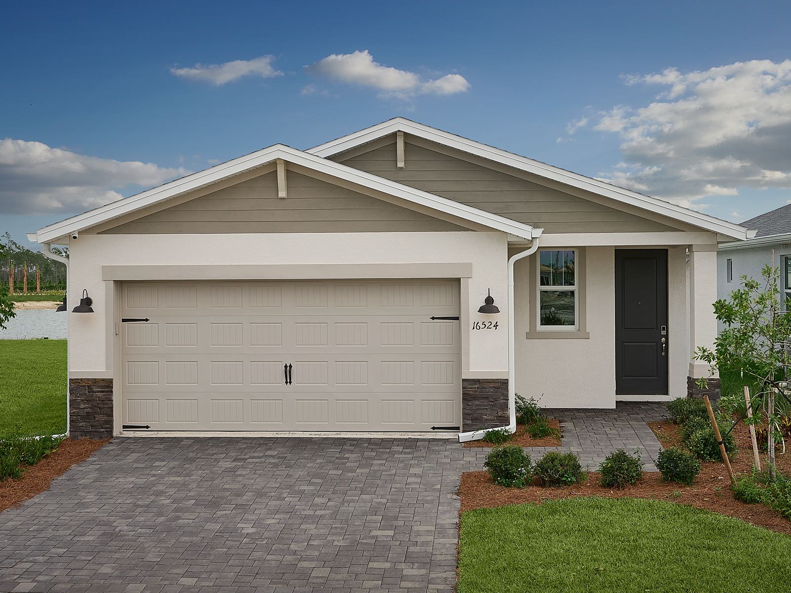 Exterior of the C elevation of the Canary floorplan modeled Crescent Lakes at Babcock Ranch