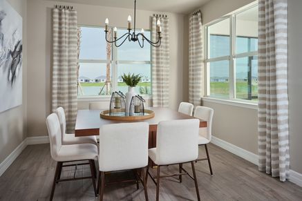 Dining room in the Willet floorplan modeled at Crescent Lakes at Babcock Ranch