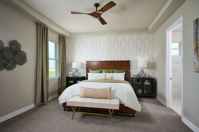 Primary bedroom in the Willet floorplan modeled at Crescent Lakes at Babcock Ranch