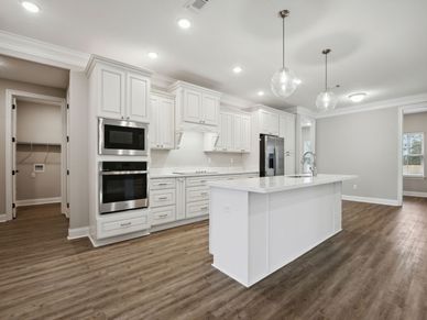 Kitchen in the Brooks floorplan at a Meritage Homes community in Gulfport, MS.