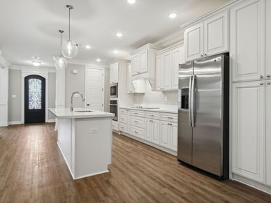 Kitchen in the Brooks floorplan at a Meritage Homes community in Gulfport, MS.