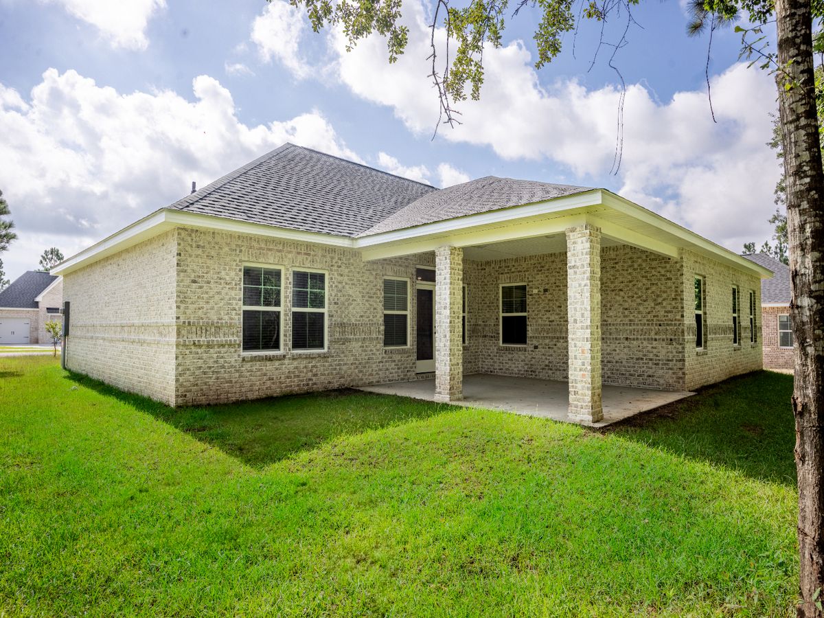 Covered rear patio in the Brooks floorplan at a Meritage Homes community in Gulfport, MS.