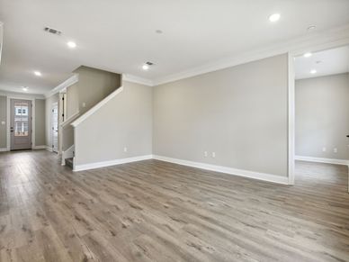Great room in the Dune floorplan at a Meritage Homes community in Gulfport, MS.