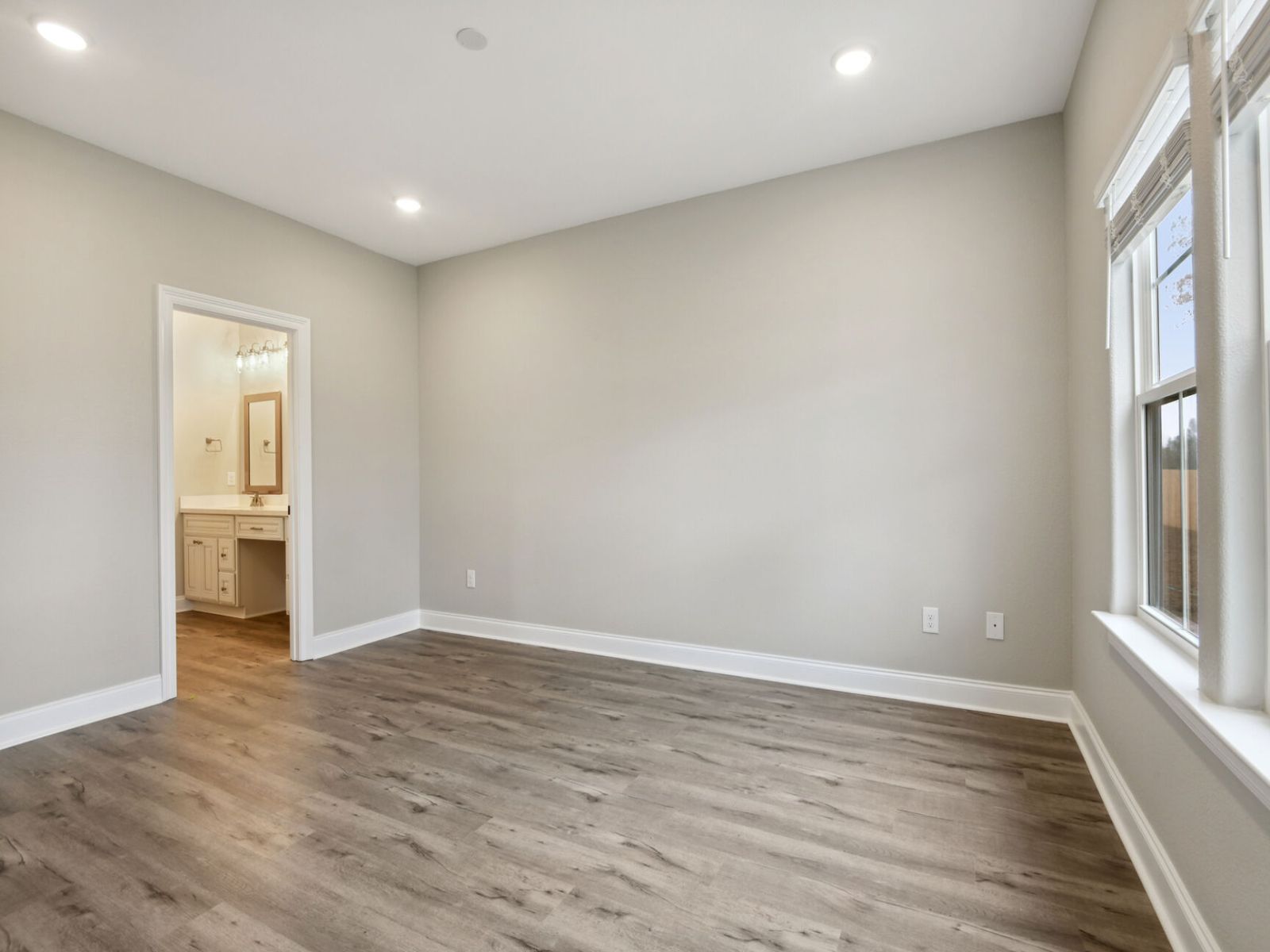 Primary bedroom in the Dune floorplan at a Meritage Homes community in Gulfport, MS.