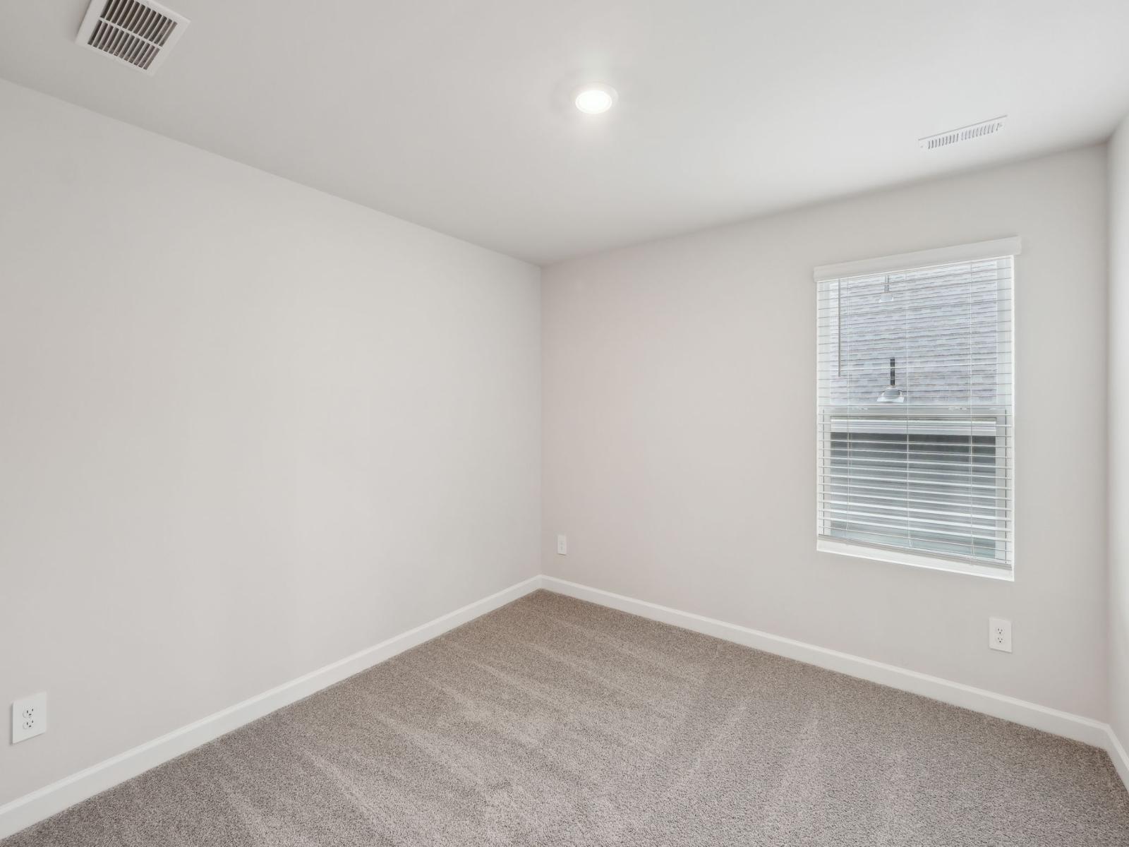 This secondary bedroom is a perfect space for guests.