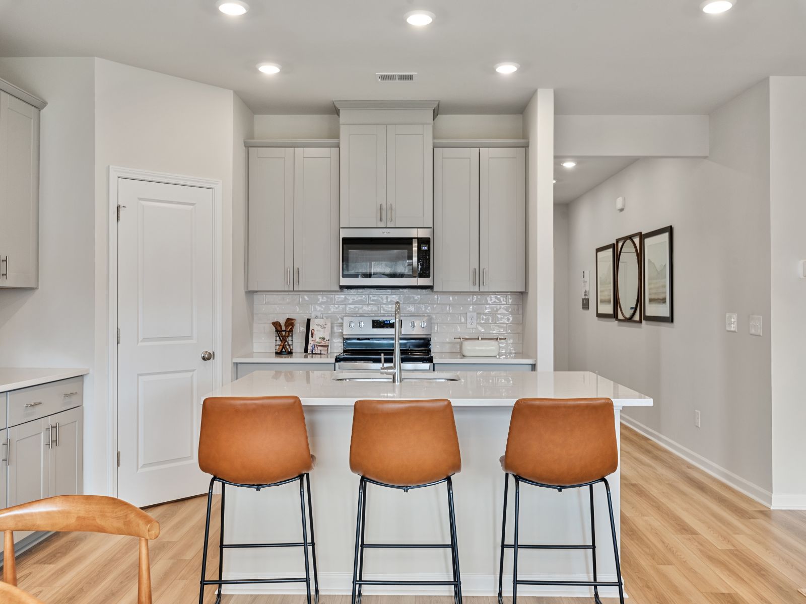 The gourmet kitchen is fitted with a walk-in pantry and designer finishes.
