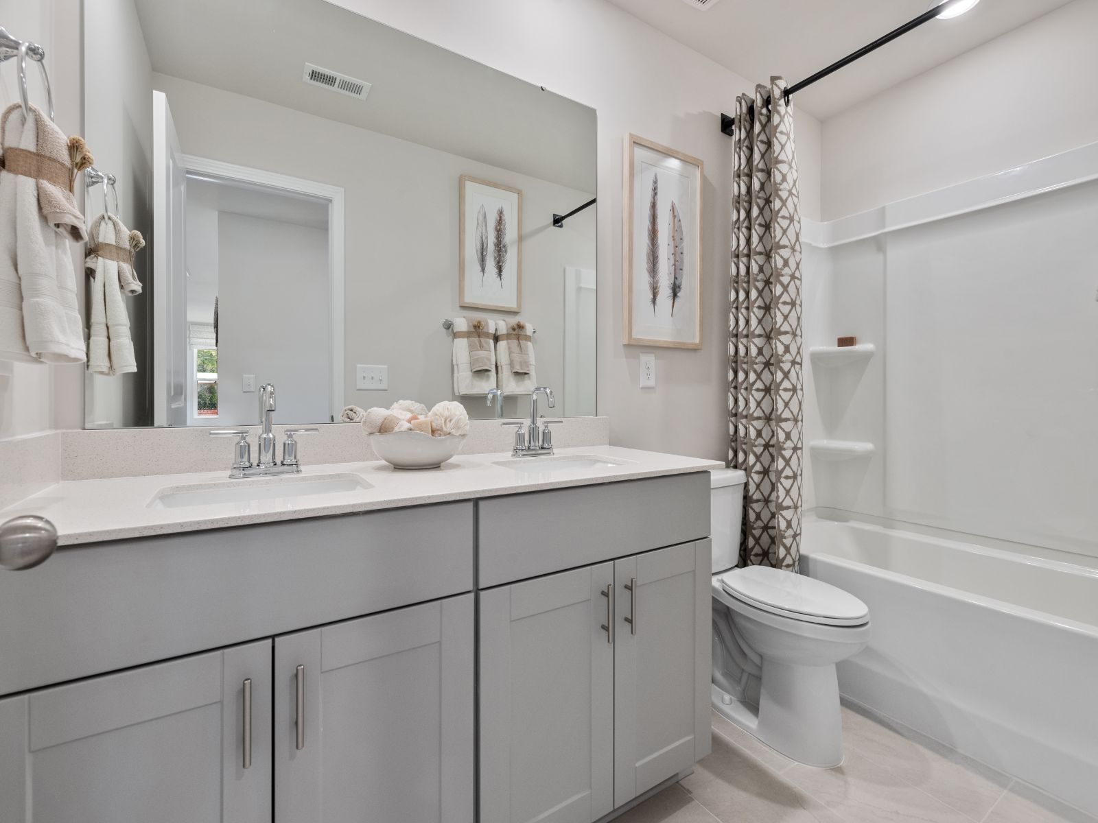 The secondary bathroom boasts dual sinks making early mornings a breeze.