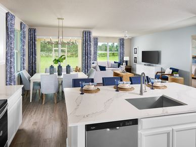 Great room in the Corsica floorplan modeled at Brystol at Wylder