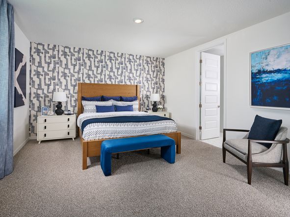 The Primary Bedroom of the Jasmine Model at the Grove at Stuart Crossing.