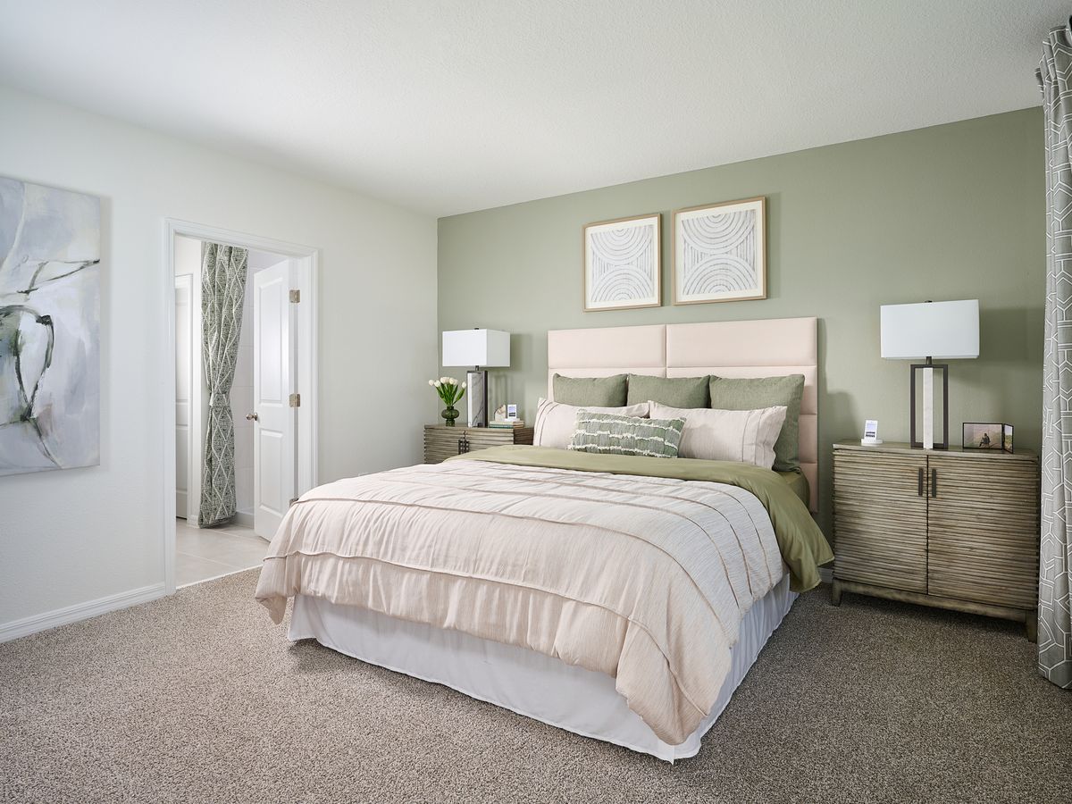 The primary bedroom of the Yellowstone modeled at The Grove at Stuart Crossing.