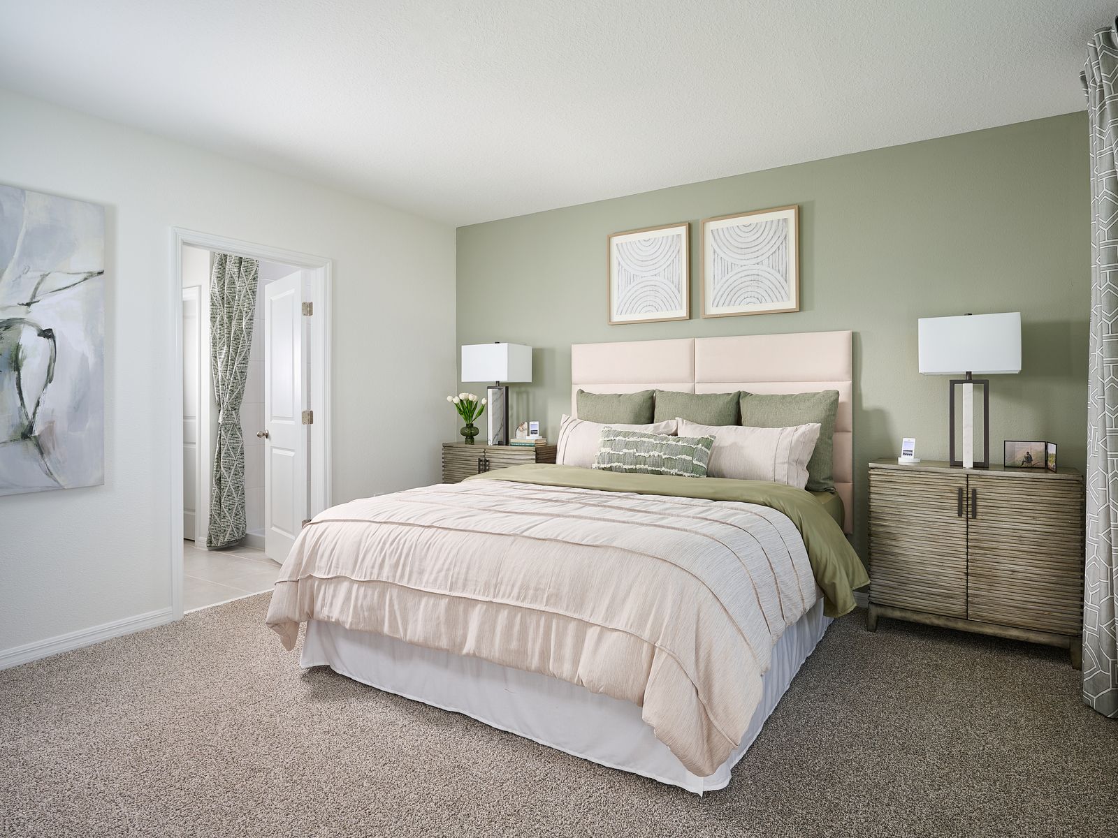 The Primary Bedroom of the Model at the Grove at Stuart Crossing.