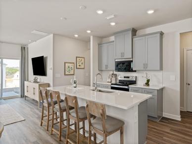 Gather the family around the kitchen island while cooking dinners.
