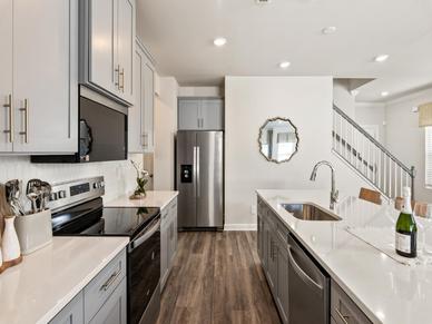 The well-appointed kitchen with a large island makes meal prep a breeze.