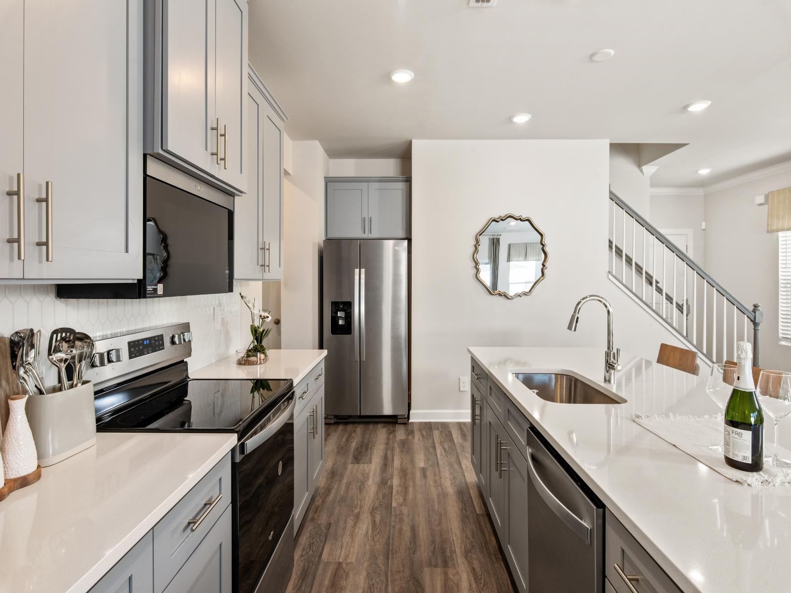 The well-appointed kitchen with a large island makes meal prep a breeze.