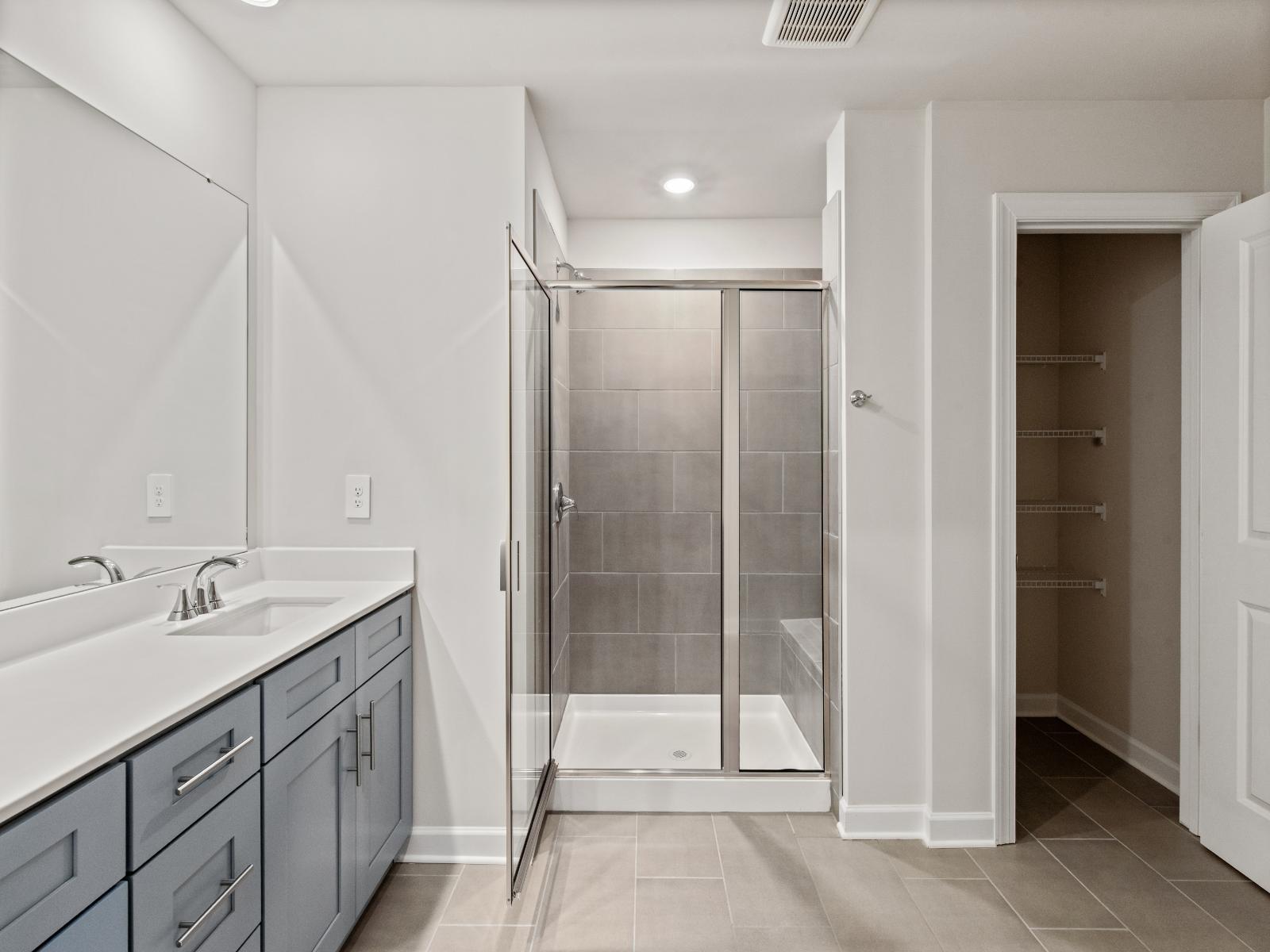 The primary bath offers dual vanity sinks.