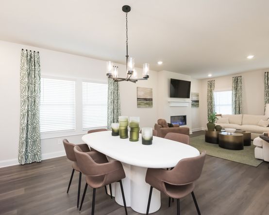 Gather the family around the dining table, at the heart of the open-concept living area.