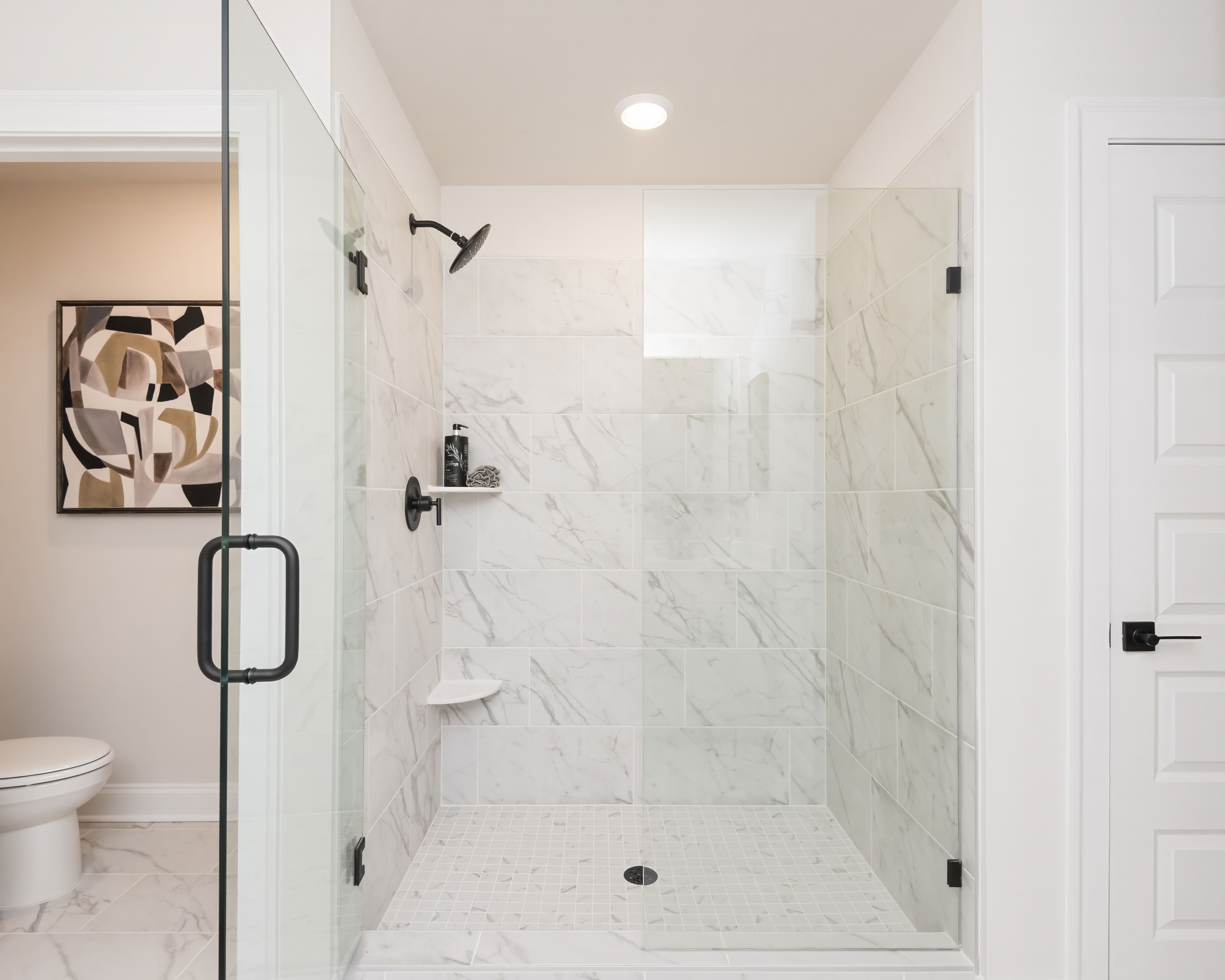 The primary bathroom is complete with a stunning walk-in shower.
