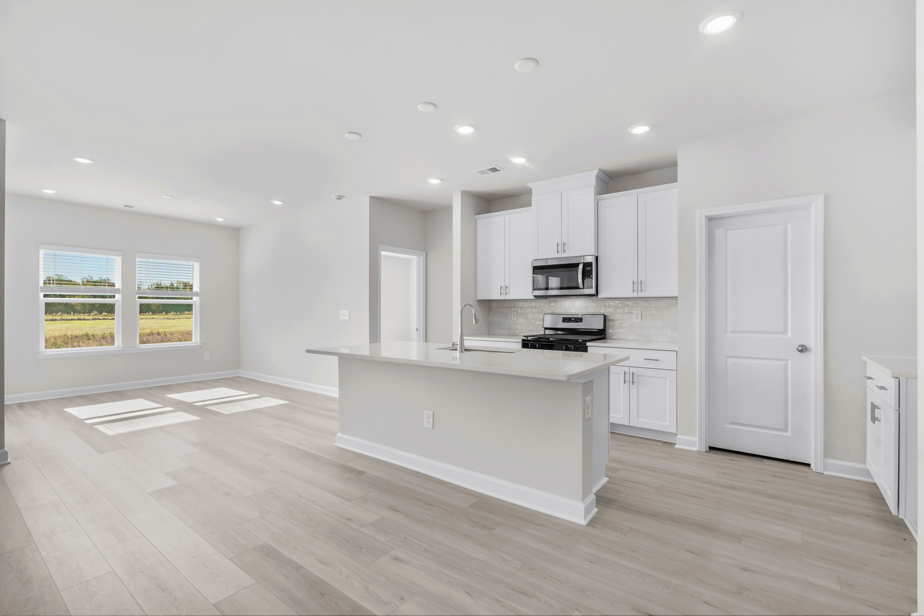 Enjoy preparing meals in this open kitchen with large work island.