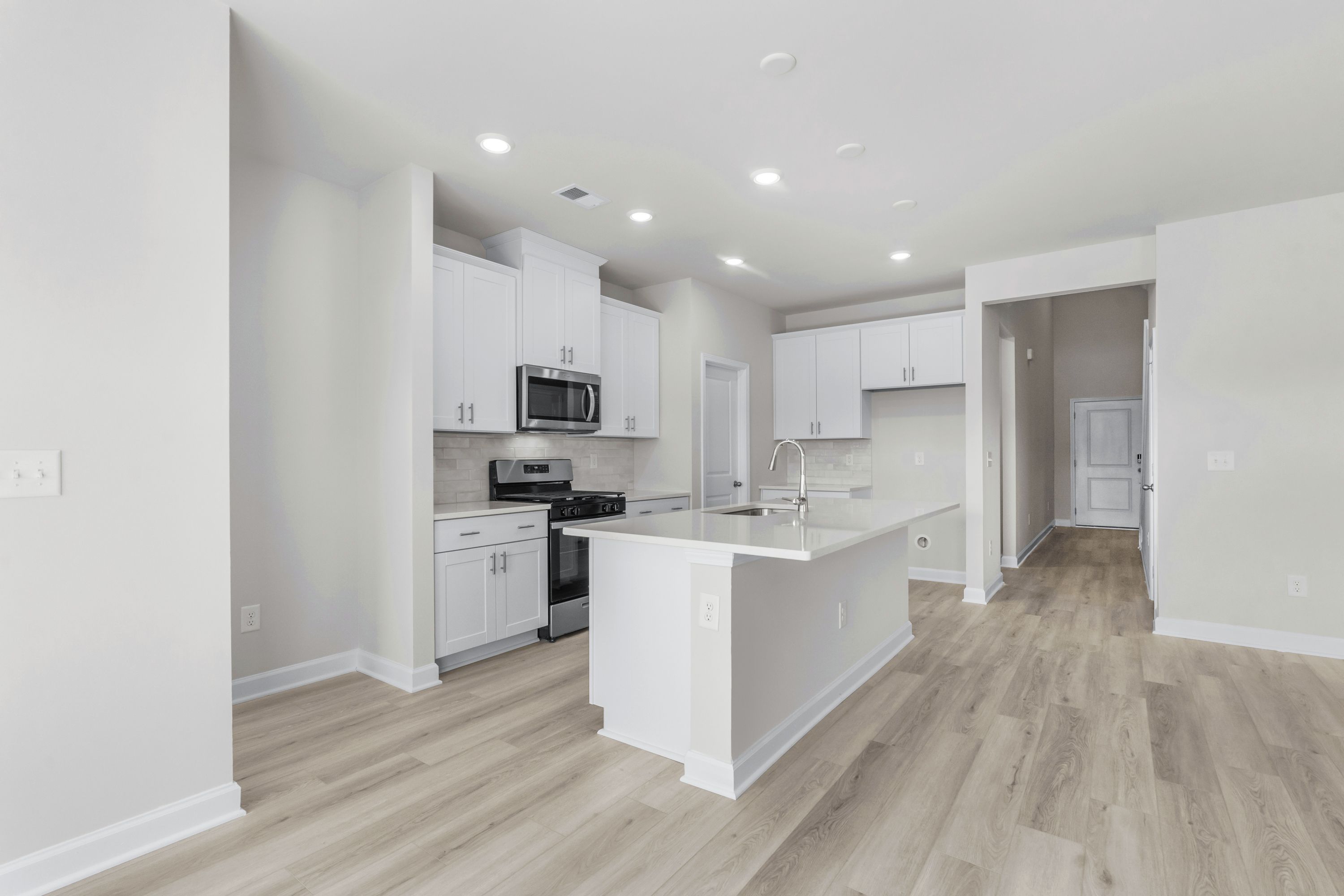 Enjoy preparing meals in this open kitchen with large work island.