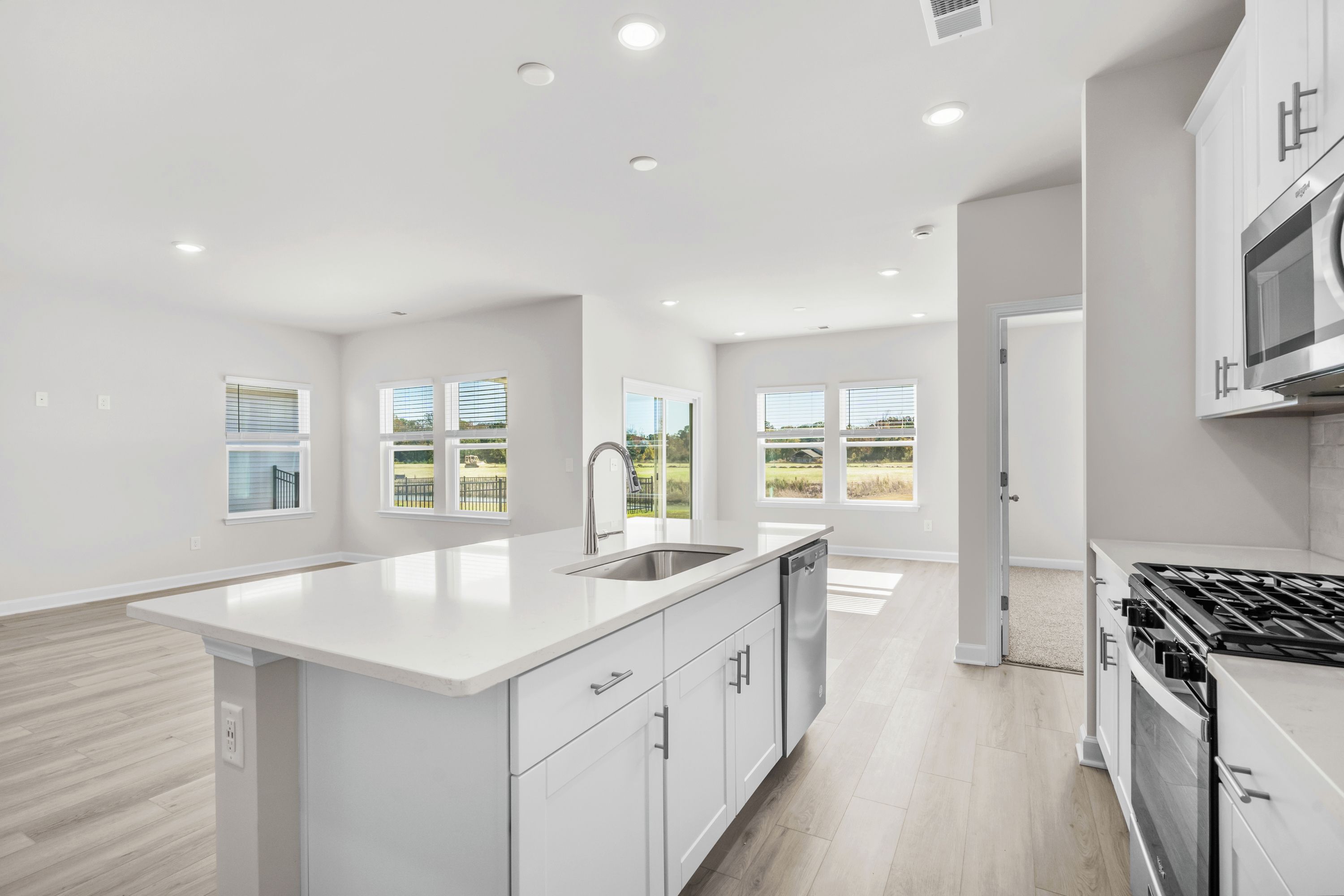 The stunning open-concept floorplan allows for easy flow between the kitchen and dining areas.