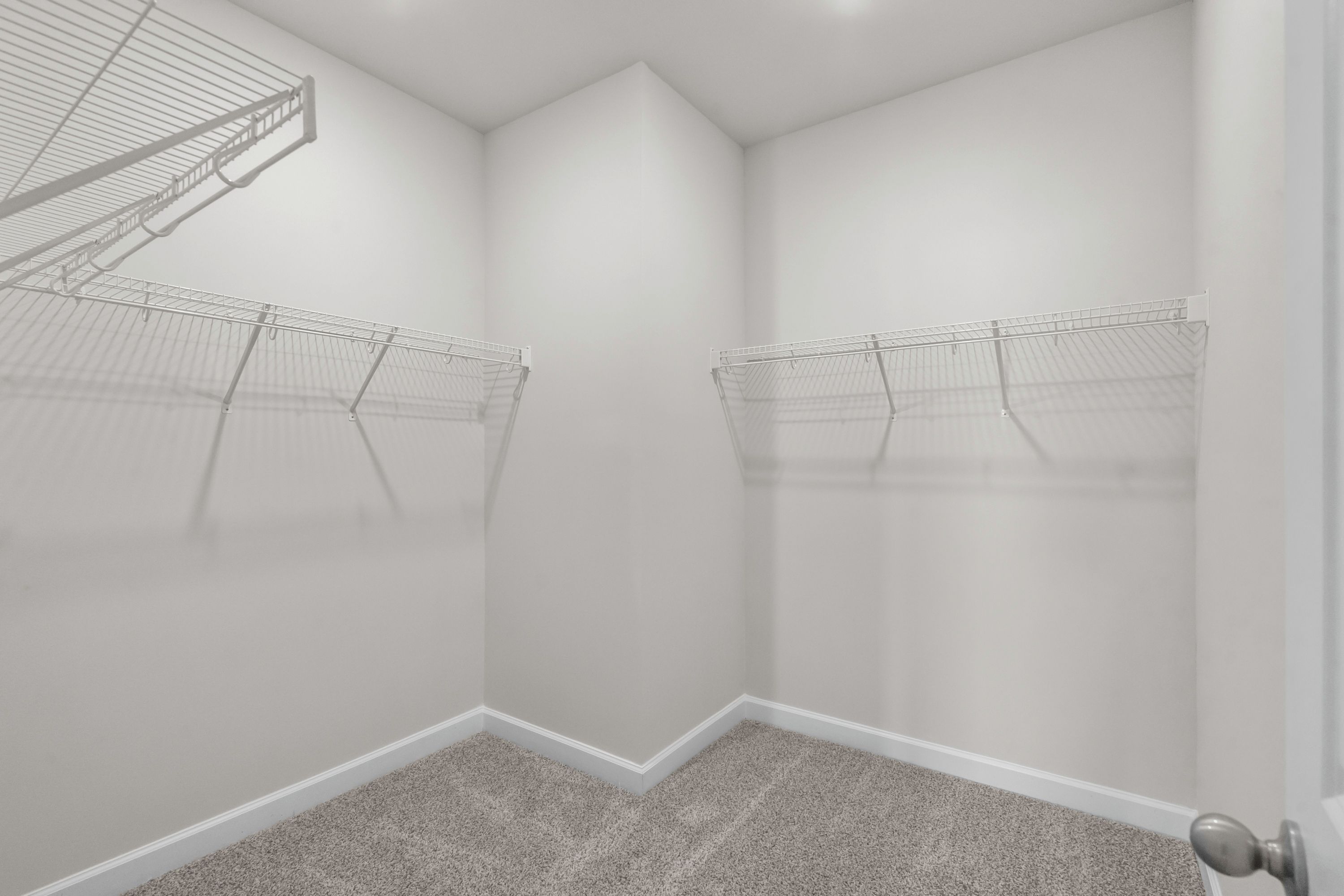 The walk-in closet off of the primary bathroom offers an abundance of space.