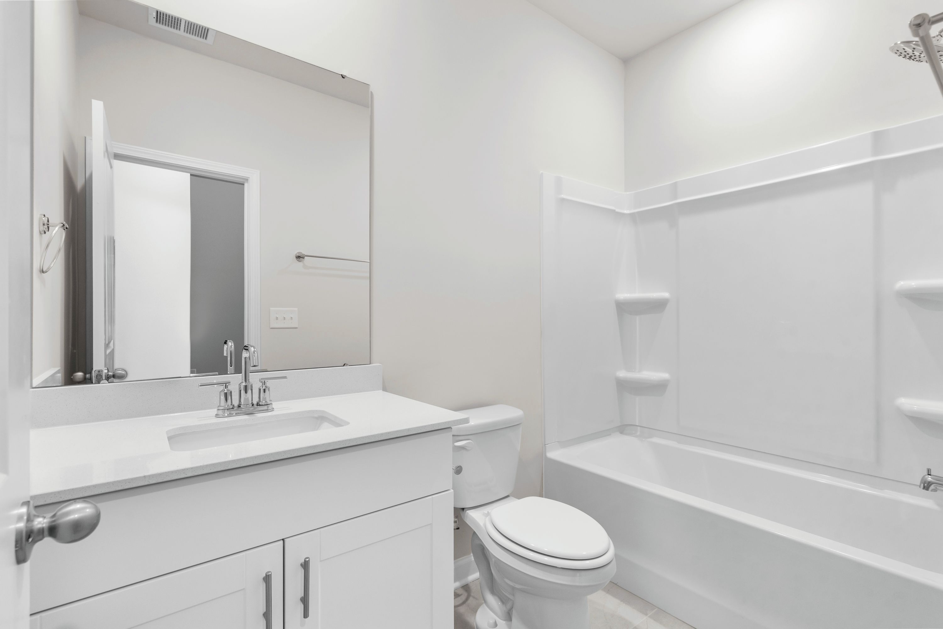 A full bathroom is located next to the secondary bedrooms.