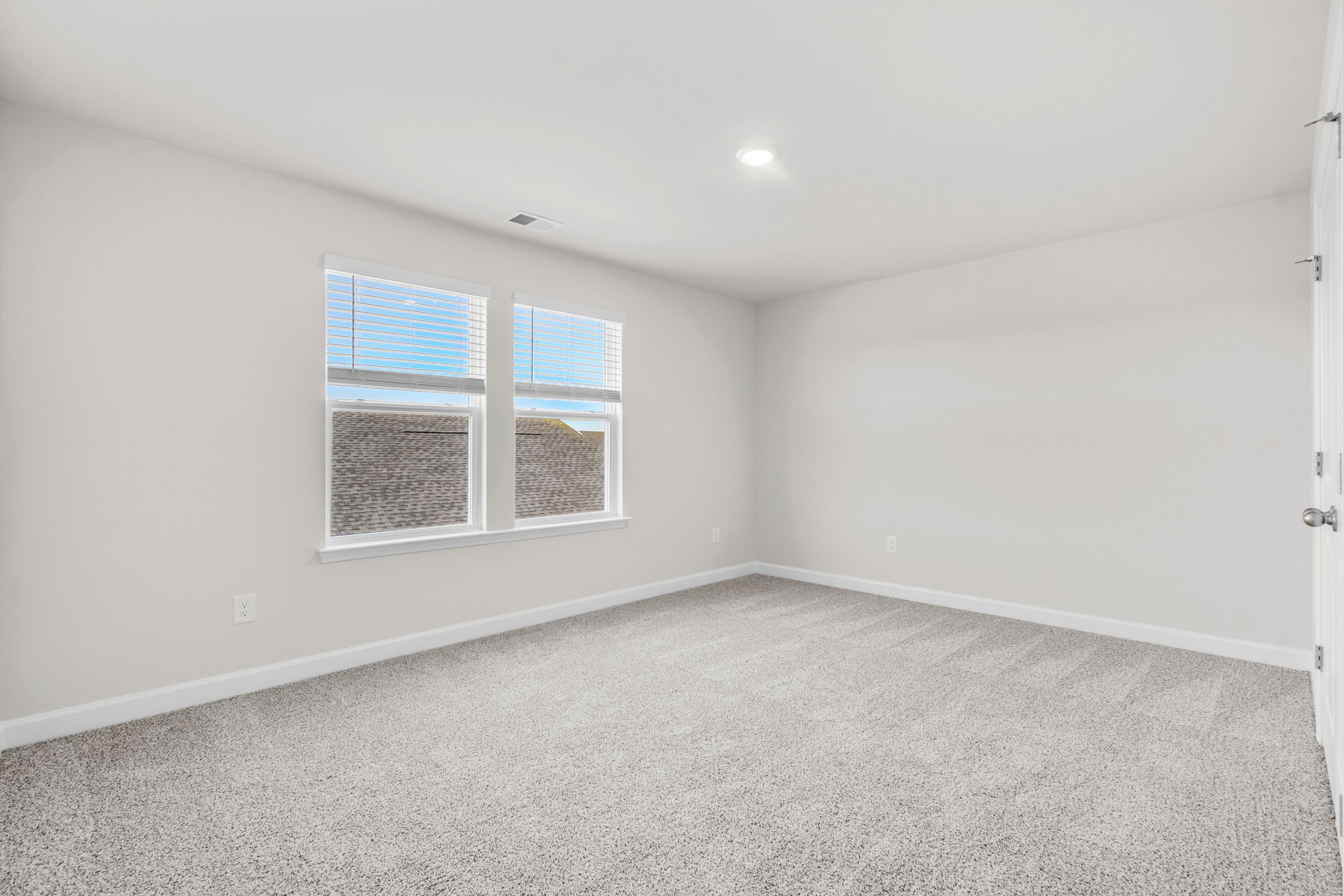 A private bedroom is located upstairs off of the loft.