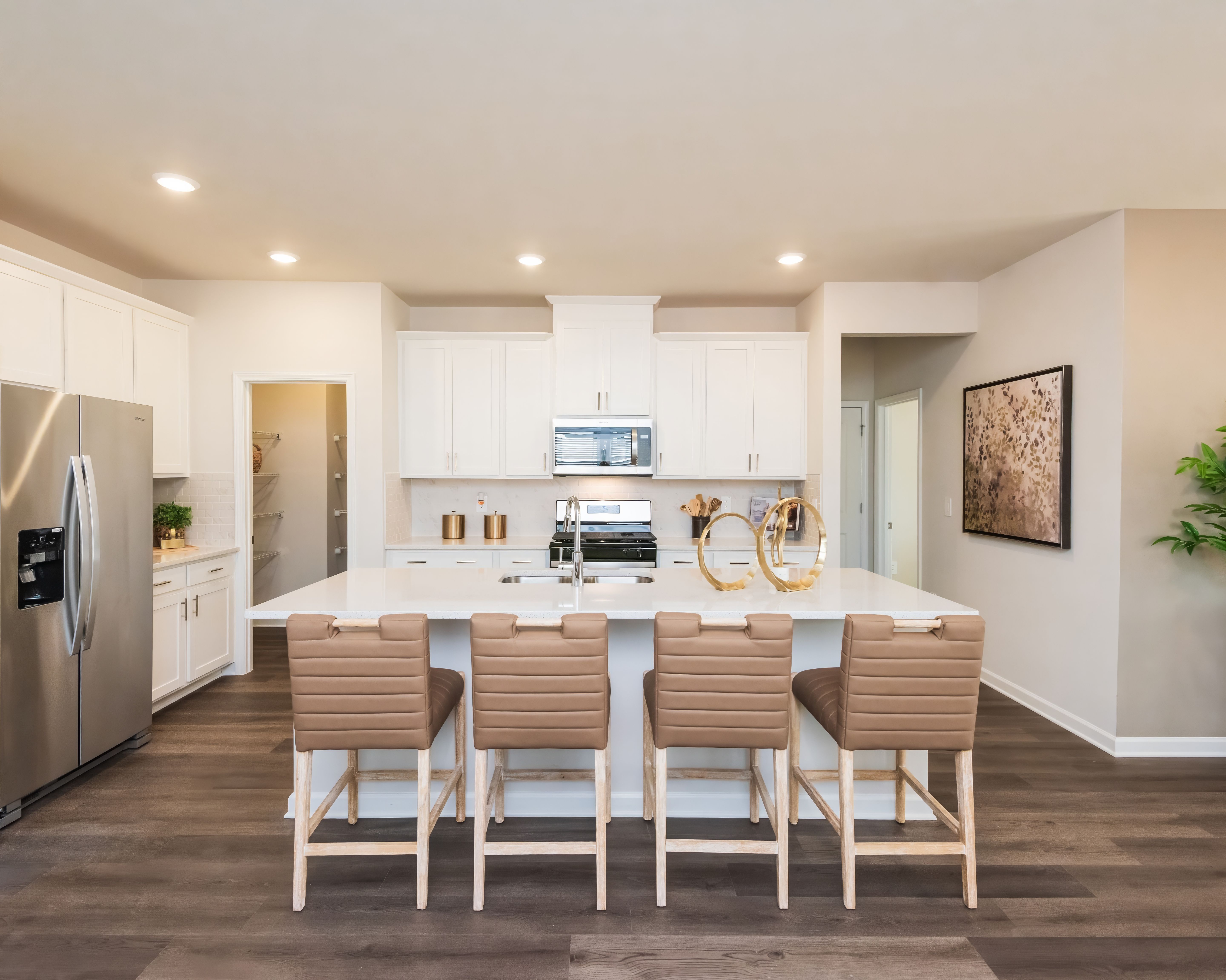 The kitchen overlooks into the dining room and living room.