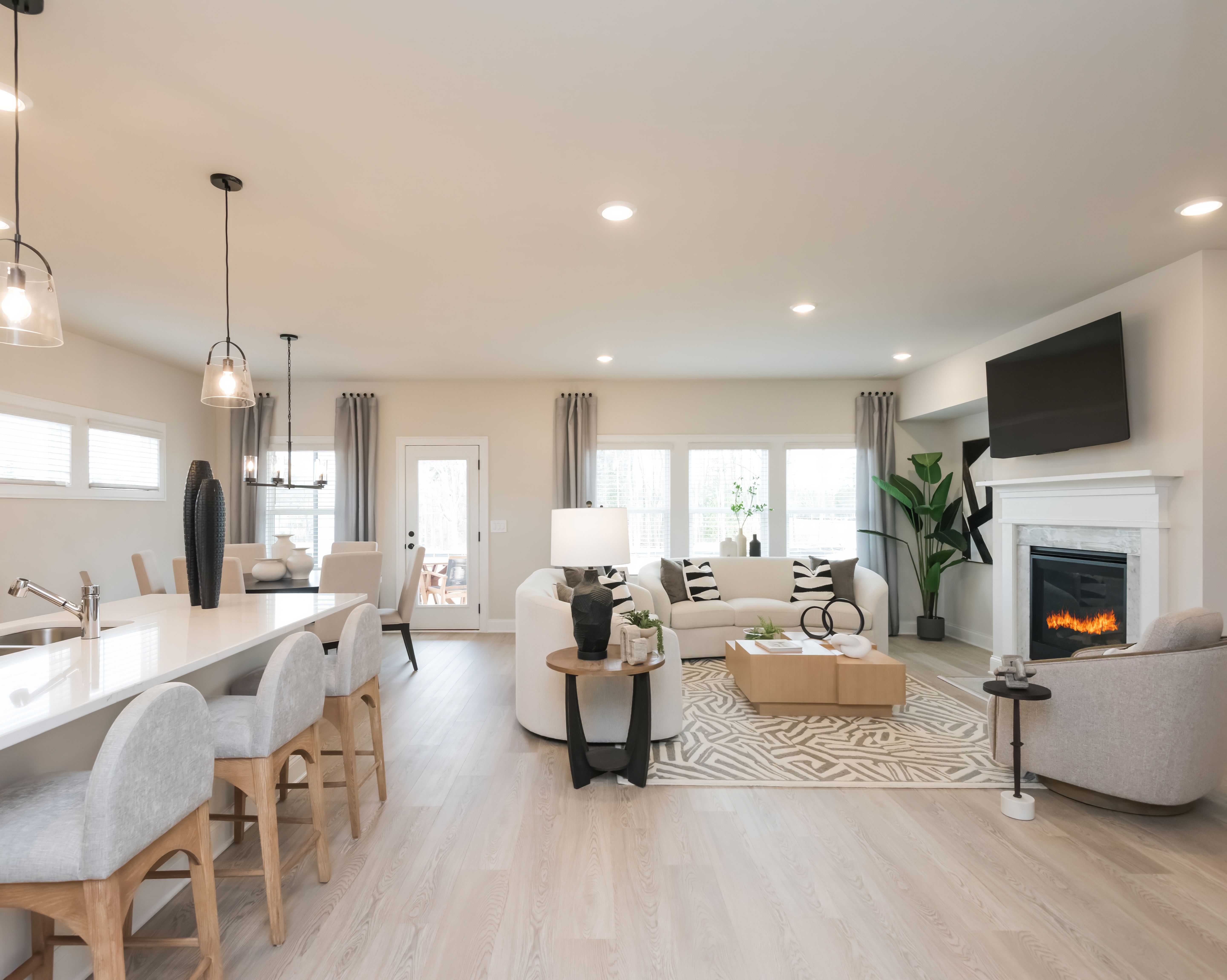 Cook dinner while chatting with family in this open-concept layout.