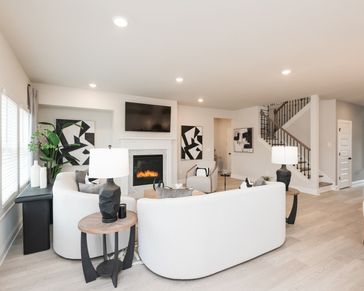 The kitchen and dining room overlook into the living room.