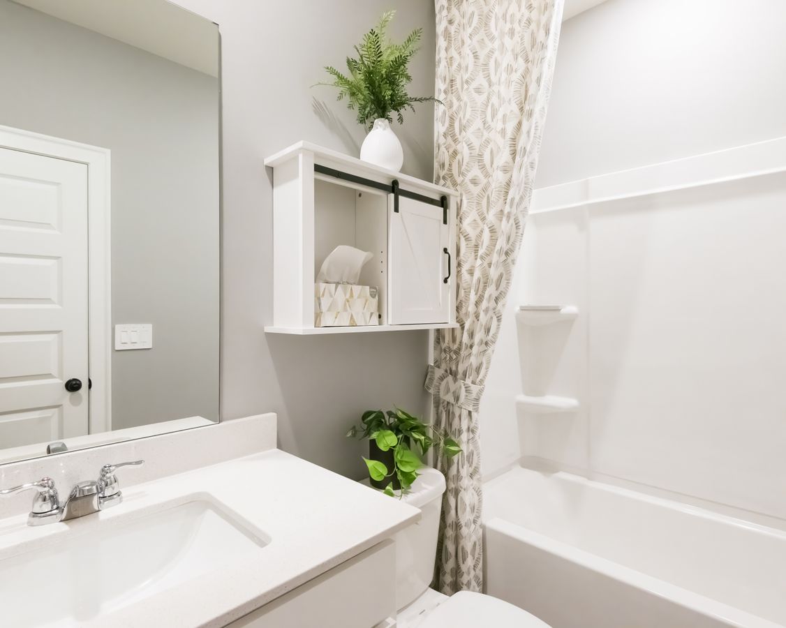 A downstairs full bath is the perfect guest retreat.