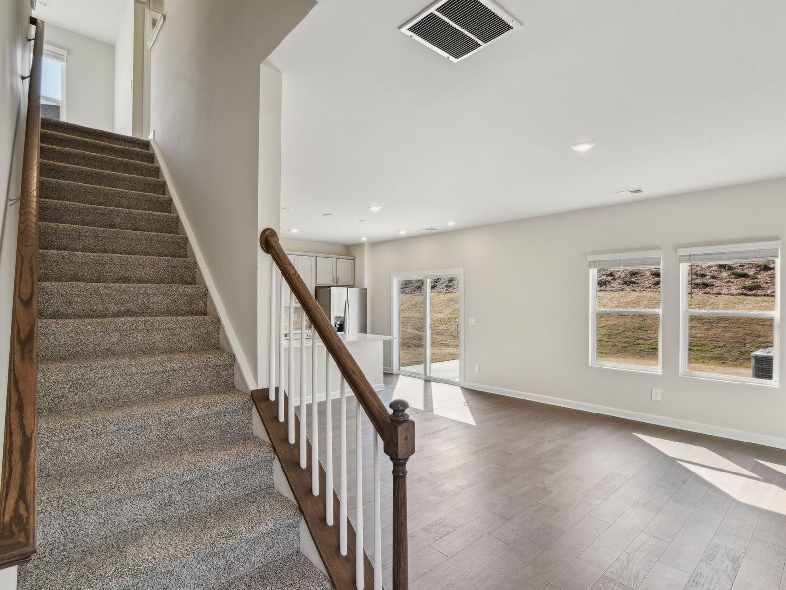 Head into the great room and kitchen or find your favorite spot upstairs.