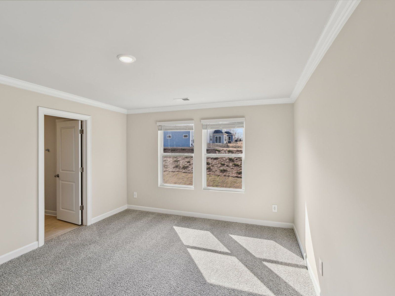 Relax and unwind in the luxurious primary bedroom.