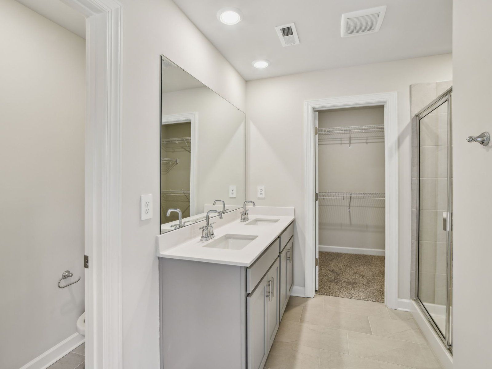The primary bathroom connects to the bedroom, making privacy and comfort a priority.