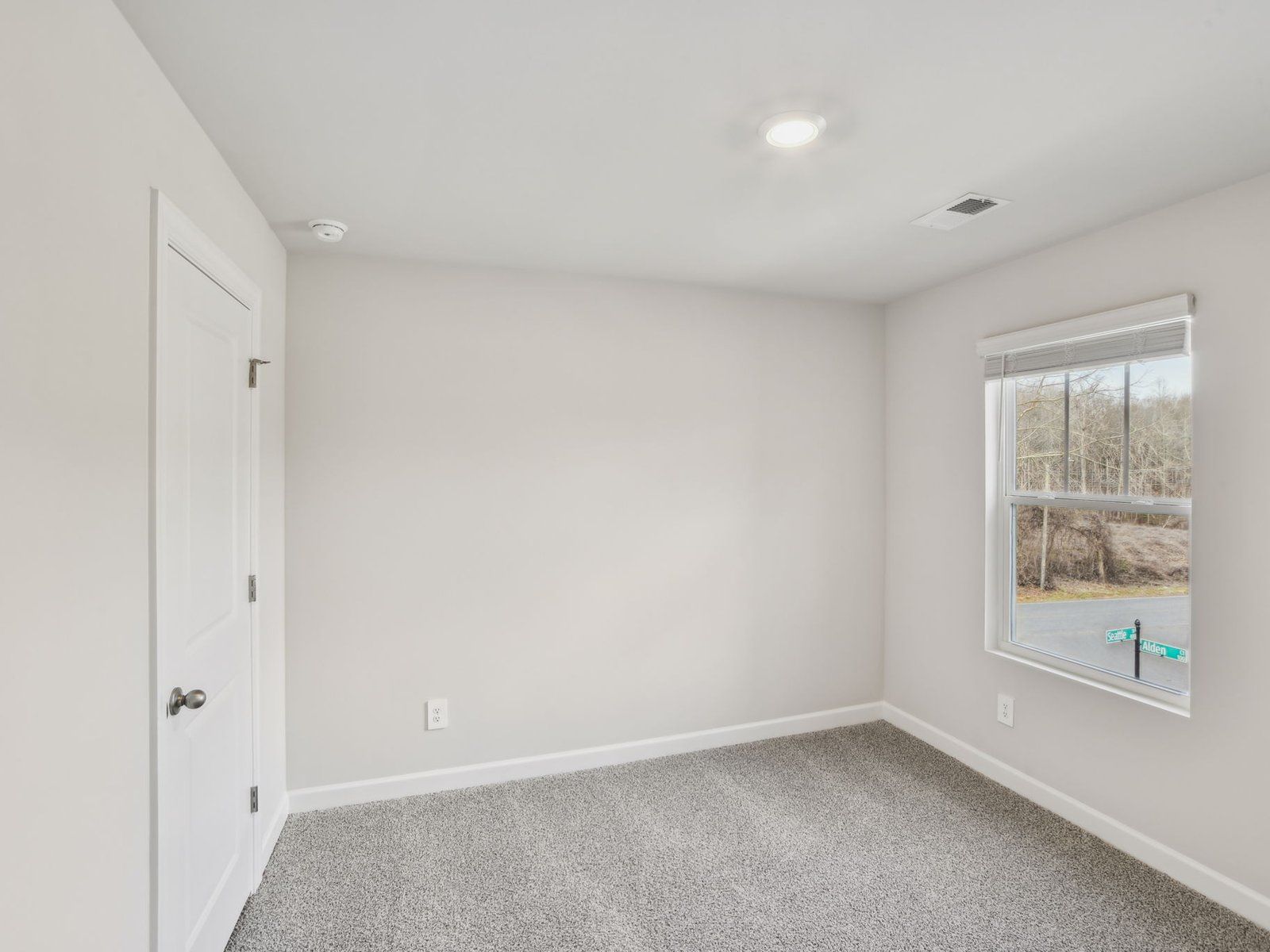 This secondary bedroom is perfect for guests or your home gym.
