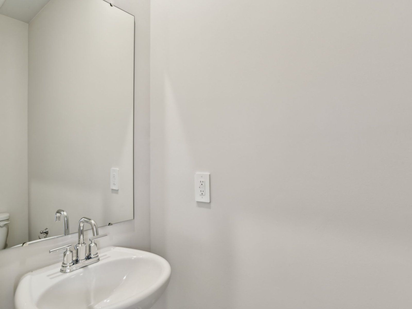 The half bathroom is located on the first floor for guests and friends.