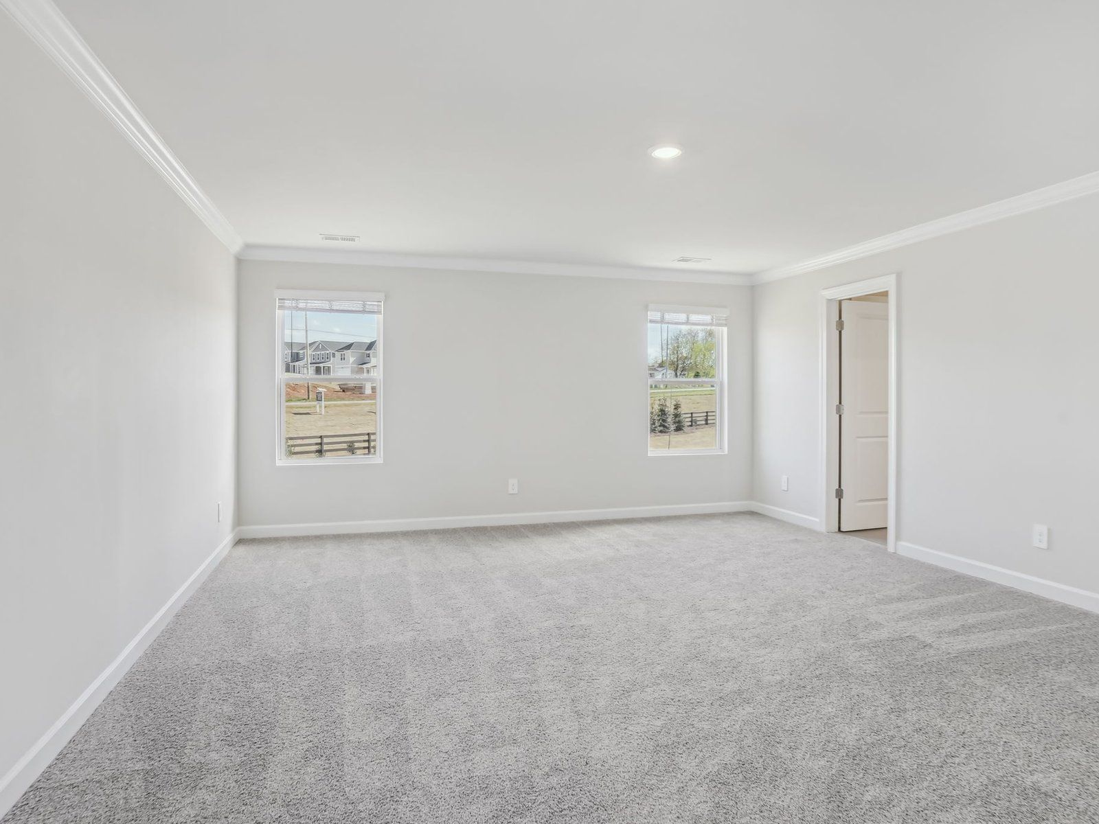 Sit back and relax in the spacious primary bedroom.