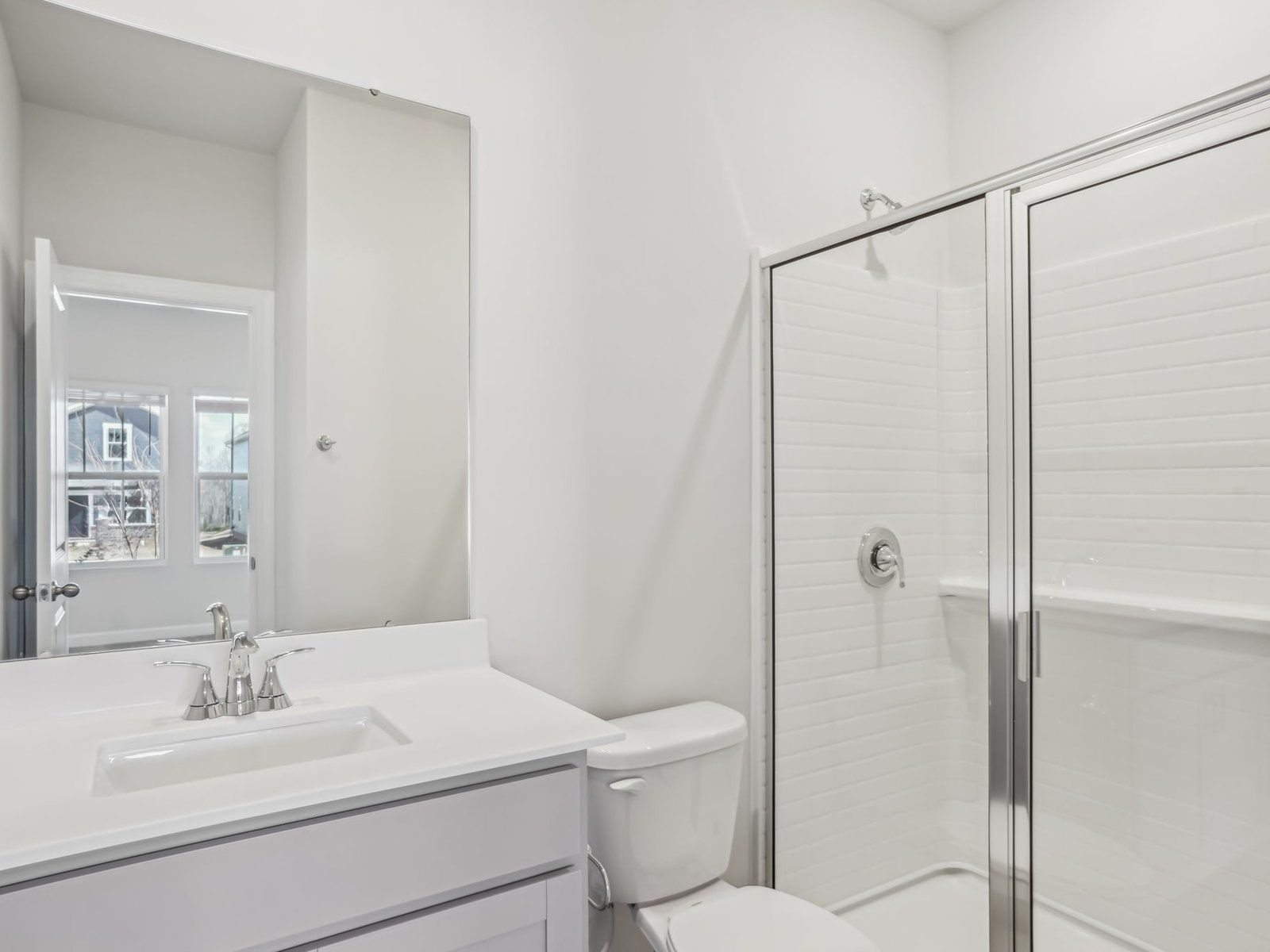 The secondary bathroom offers cabinet storage for your self-care essentials.