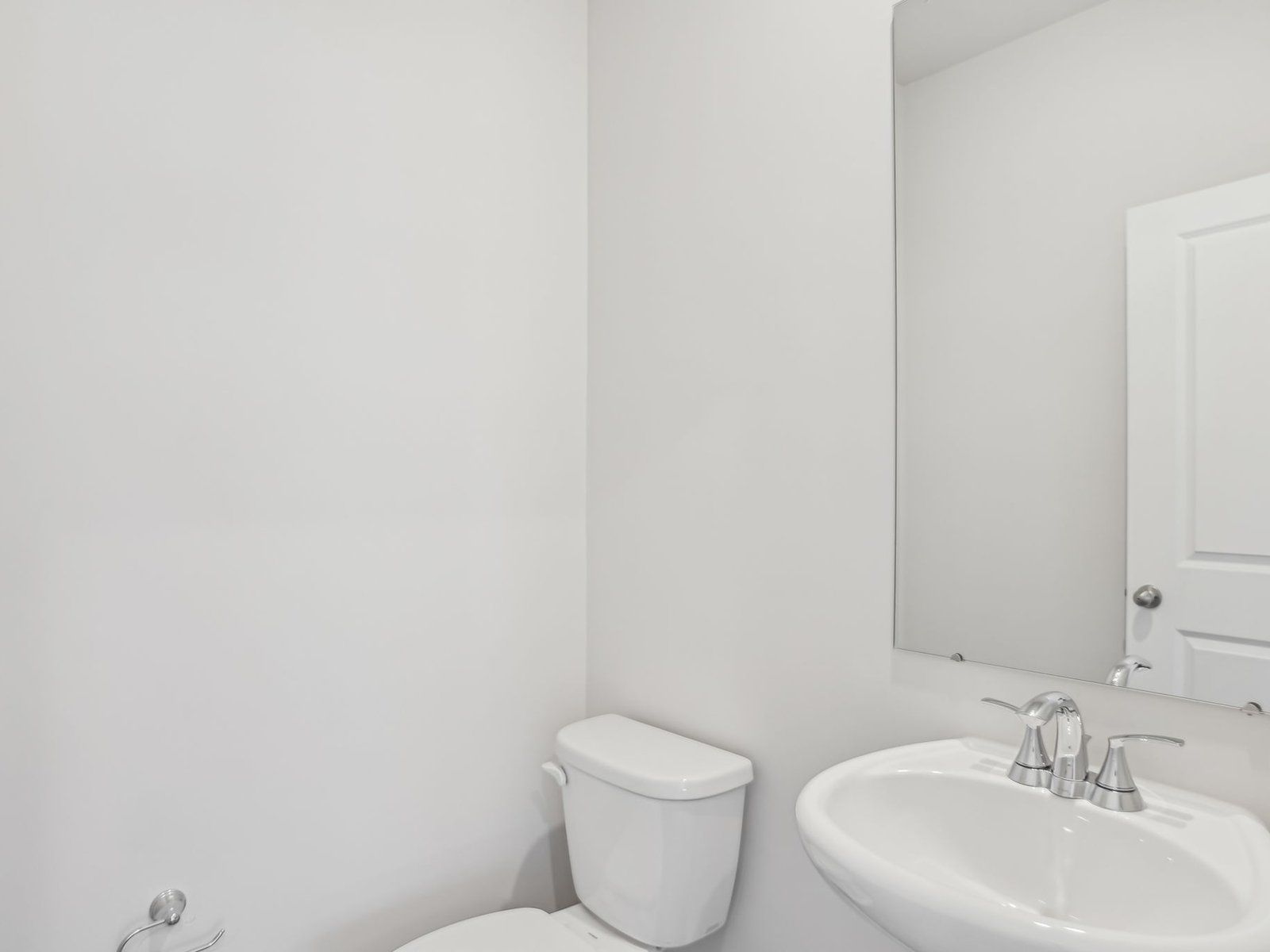 The half bathroom is conveniently located on the first floor for guests and visitors.