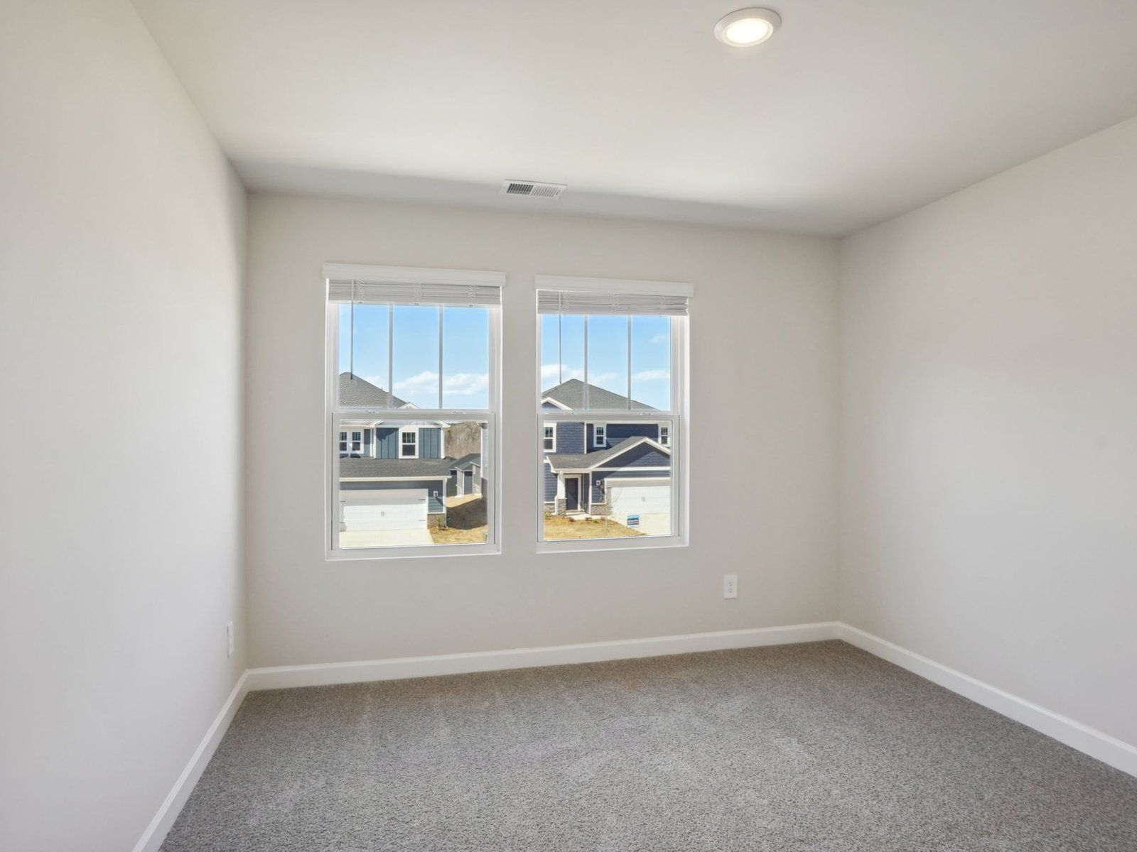 This secondary bedroom showcases plenty of natural light.