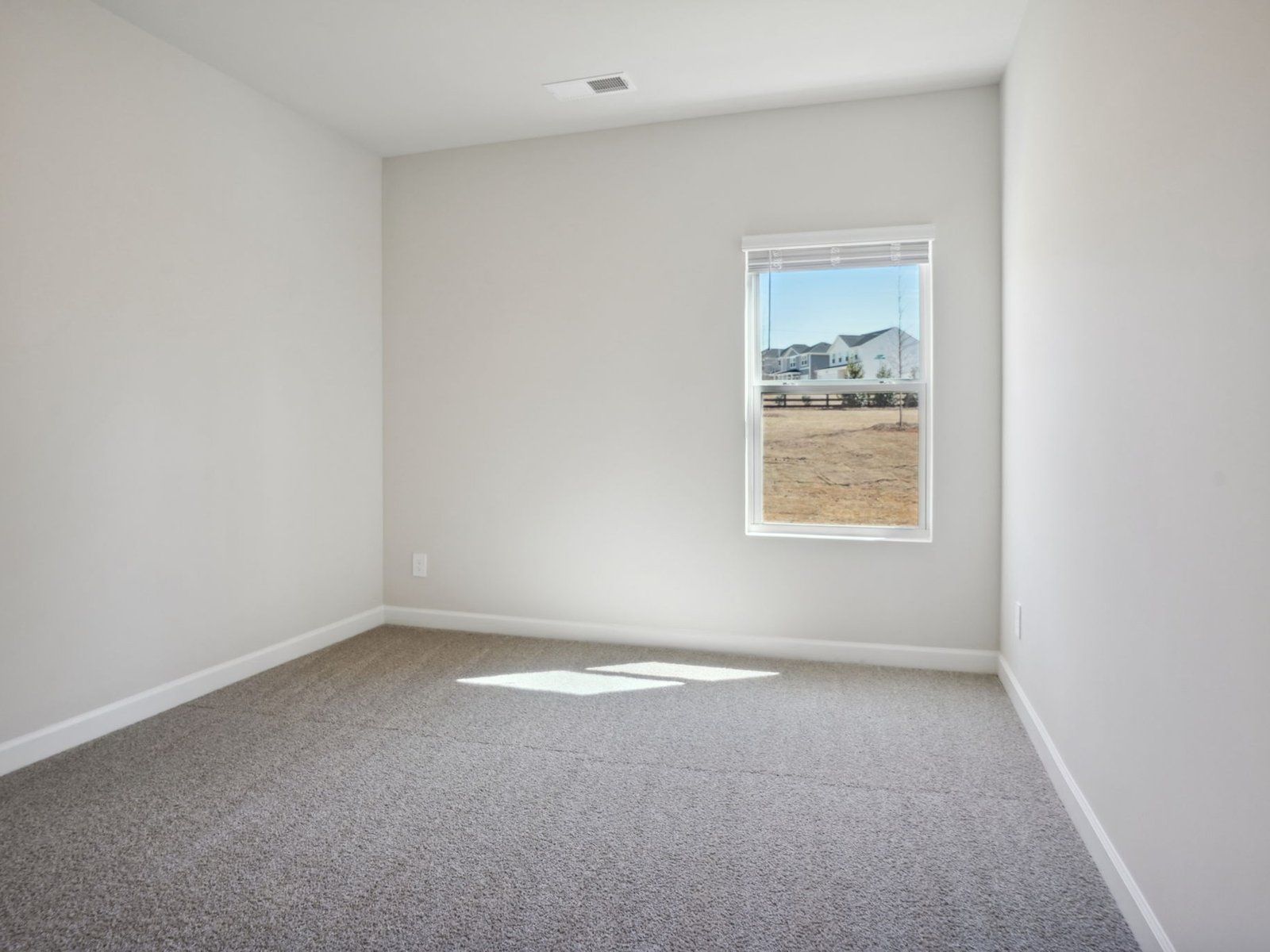This secondary bedroom is the ideal work-from-home office space.