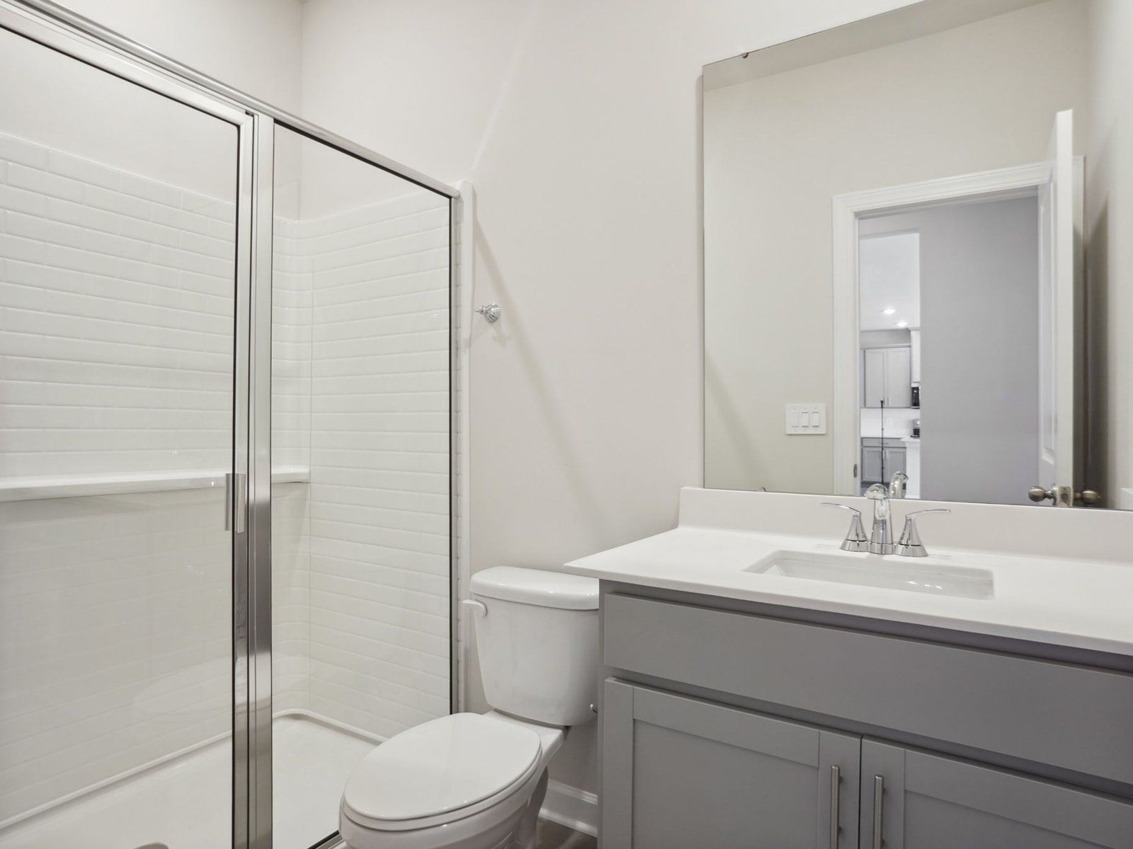 This secondary bathroom features a spa-like walk-in shower.